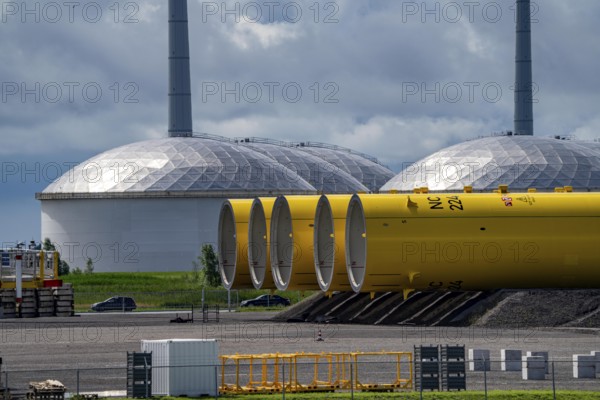 The seaport of Eemshaven, Julianahaven Basin, where the foundation structures, monopiles, for offshore wind farms are stored, which then support the actual wind turbines, the components are transported to the wind farms in the North Sea on large workboats and anchored to the seabed, where the wind turbines are then built, Eemshaven, Netherlands