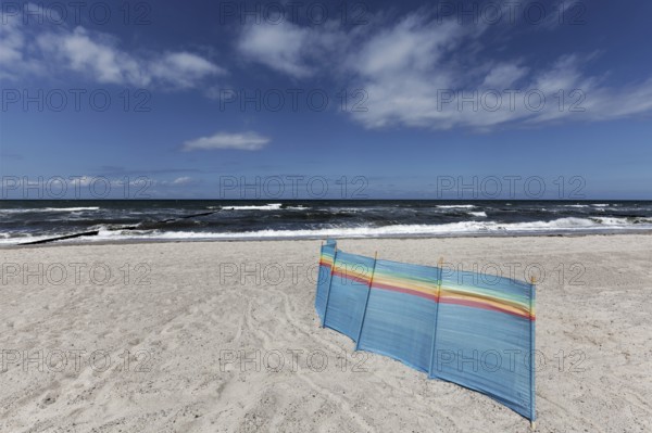 Deserted Baltic Sea beach with a single windbreak, blue sky, Kühlungsborn, Baltic Sea, Mecklenburg-Western Pomerania, Germany