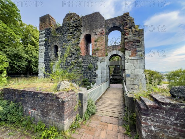 View from the location of the northern tower over a small bridge to the ruins of the imperial palace of Emperor Frederick I Barbarossa, Kaiserswerth, Düsseldorf, North Rhine-Westphalia, Germany, built in the Middle Ages around 1184 on today's banks of the Rhine