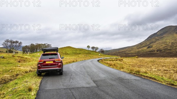 Off road 4x4 car with tent roof on Isle of Sky, Scotland, UK