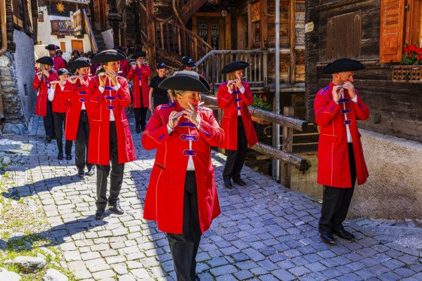 Pipers and drummers accompany the Corpus Christi procession, historic town centre, Grimentz, Val d'Anniviers, Valais Alps, Canton Valais, Switzerland
