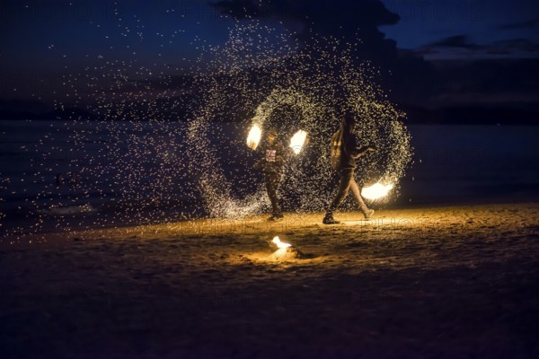 Fire show, jugglers with fire, Ao Nang Beach, sunset, Ao Nang, Krabi, Thailand