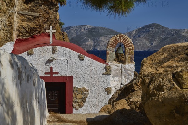 Legend, Crab, Mussel fisherman, White-red chapel in rocky landscape with view of the sea, surrounded by mountains, Chapel, Little church, Monastery Agia Kavouradena, Xirokambos, Leros, Dodecanese, Greek Islands, Greece