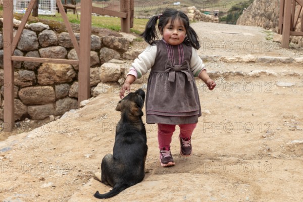 Girl with dog, Chinchero, Sacred Valley, Peru