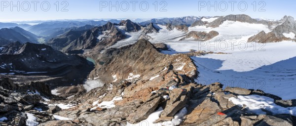 Rocky ridge on the Wilder Freiger mountain peak, behind Signal summit and Becher summit with Becherhaus, picturesque high mountain landscape, view of Übeltalferner glacier and rocky mountain peaks Königshofspitz and Sonklarspitze, Stubai Alps, South Tyrol, Italy