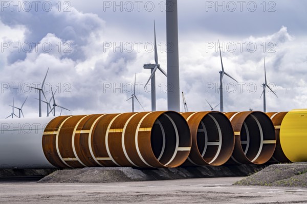 The seaport of Eemshaven, Julianahaven Basin, where the foundation structures, monopiles, for offshore wind farms are stored, which then support the actual wind turbines, the components are transported to the wind farms in the North Sea on large workboats and anchored to the seabed, where the wind turbines are then built, Eemshaven, Netherlands