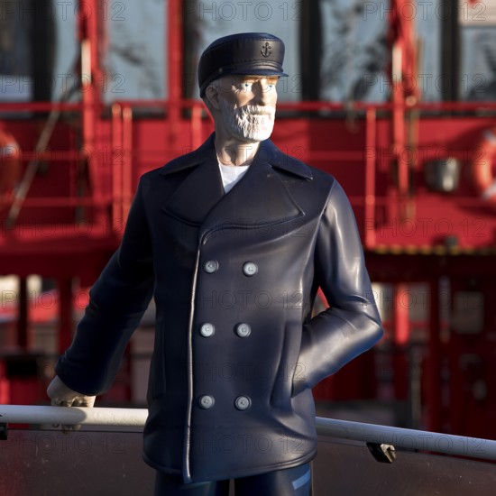 3-D figure of the captain permanently installed on the bow of the harbour ferry of line 62 in front of the ferry St. Pauli, Finkenwerder, Hamburg, Germany