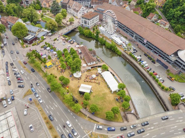 Aerial view of a Ferris wheel and a river in a summer town, 950 years of Calw, Calw parade, Black Forest, Germany
