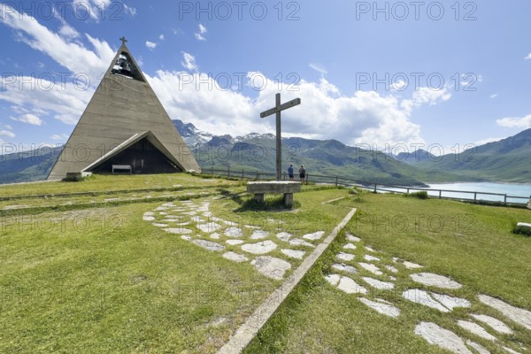 1967 above the Lac du Mont Cenis on the right of the picture, the Musée Museo Mont-Cenis Pyramid Museum in a stylised pyramid as a museum to commemorate the Egyptian campaigns of Emperor Napoleon Bonaparte and the time in front of the construction of the reservoir, in the foreground a large free-standing Christian cross, Mont Cenis massif, Massif du Mont-Cenis, Graian Alps, Lanslebourg, Rhone-Alpes, France