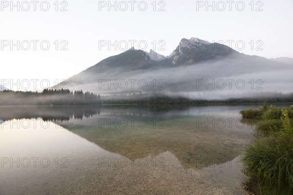 Magical sunrise with fog at Hintersee near Ramsau in Berchtesgadener Land