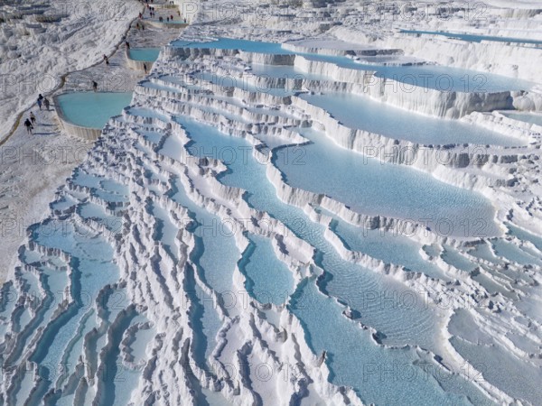 Detailed photo of cascading limestone terraces with turquoise-coloured water, aerial view, sinter terraces, limestone terraces, travertine terraces, Pamukkale, Denizli, UNESCO World Heritage Site, Anatolia, Turkey