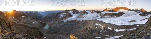 Panorama at sunrise with alpenglow, high mountain landscape, view of blue glacial lakes, mountain peaks Königshofspitz and Hofmannspitze with glacier of the Übeltalferner, Stubai Alps, South Tyrol, Italy