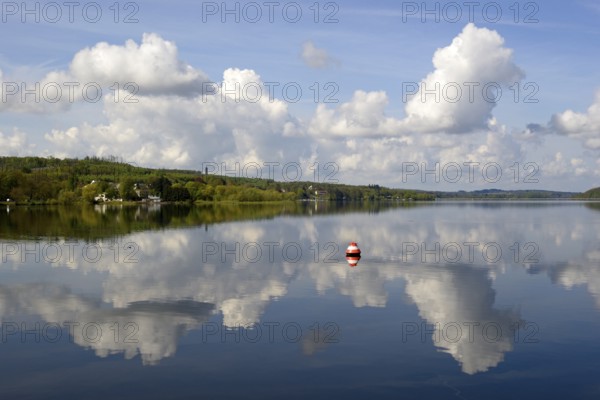 View over the Möhnesee, Möhnesee tower, red and white buoy, blue cloudy sky, reflection on the water surface, Möhnetalsperre, North Rhine-Westphalia, Germany