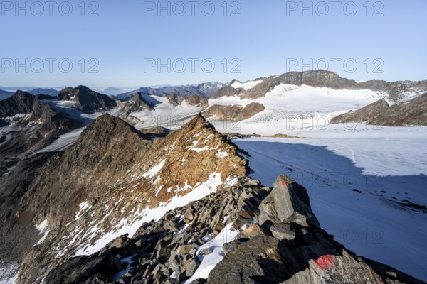Rocky ridge on the Wilder Freiger mountain peak, behind Signal summit and Becher summit with Becherhaus, picturesque high mountain landscape, view of Übeltalferner glacier and rocky mountain peaks Königshofspitz, Sonklarspitze and Schwarzwandspitz, Stubai Alps, South Tyrol, Italy