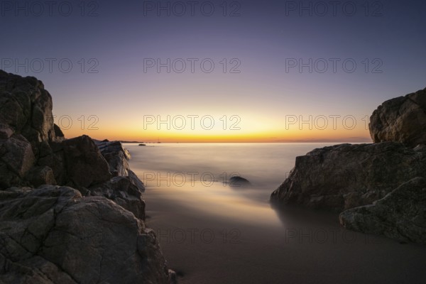 The sun rises on the Costa Rei, a stretch of coastline on the Italian Mediterranean island of Sardinia, Monte Nai, Costa Rei, Sardinia, Italy