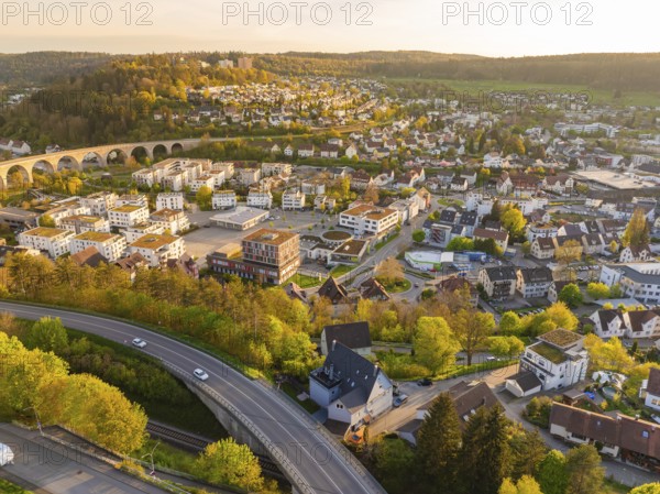 Aerial view of town with viaduct, houses and green hills, Nagold, Black Forest, Germany