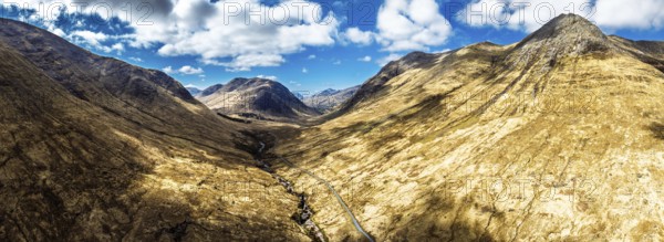 Panorama of Mountains and Moors over Glen Etive Valley from a drone, Buachaille Etive Mòr, The Buachaille, Highlands, Scotland, United Kingdom