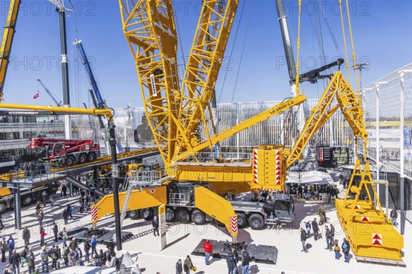 LG 1800-1.0 lattice boom crane with a maximum lifting height of 204 metres for wind turbines. BAUMA Munich, 34th World's Leading Trade Fair for Construction Machinery, Building Material Machines, Mining Machines, Construction Vehicles and Construction Equipment. In 2025, the trade fair will attract around 600, 000 visitors from more than 200 countries and regions and 3601 exhibitors. Open-air area with exhibits from Liebherr. Munich, Bavaria, Germany