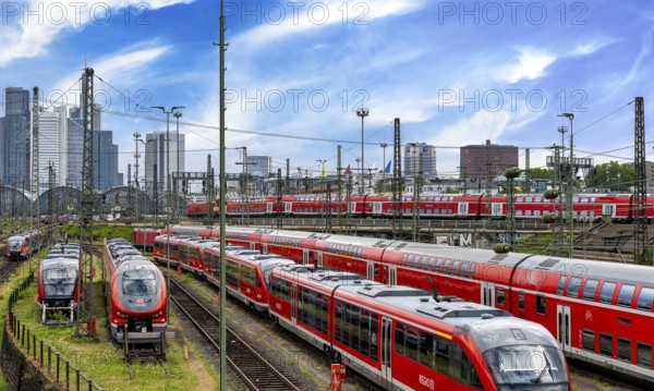Bridge at Camberger Straße, Galluswarte, Deutsche Bahn, tracks and trains with the skyline of Frankfurt am Main, Hesse, Germany