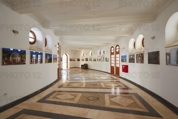Elegant exhibition room with circular mosaic and photography on the curved wall, Kalithea, Kallithea, thermal baths, spa, Rhodes, Dodecanese, Greek Islands, Greece