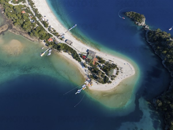 Aerial view of a small island with sandy beach and surrounding turquoise blue water and boats, Fethiye, Mugla, Mugla, Aegean Sea, Turkey