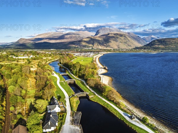 View of Caledonian Canal, Caol Beach and Nevis Range Mountains from a drone, Corpach, Fort William, Highland, Scotland, United Kingdom