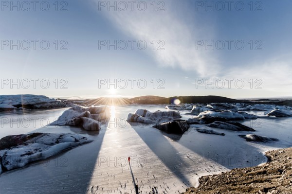 Man standing at Vatnajökull glacier, Astronaut, Ice, Rocks, Lake, Sunset, Winter, Cold, Iceland* Man standing at Vatnajokul, Spaceman, Ice, Rocks, Lake, Sunset, Cold, Iceland