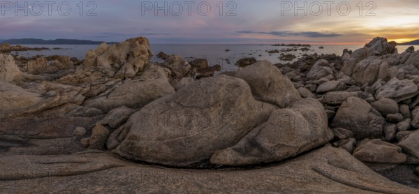 Sunset, rocky coast near Porto Pollo, Corsica, France