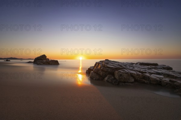 The sun rises on the Costa Rei, a stretch of coastline on the Italian Mediterranean island of Sardinia, Monte Nai, Costa Rei, Sardinia, Italy