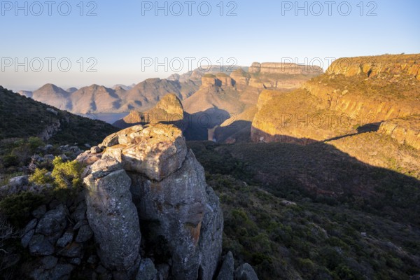 Sunset at Blyde River Canyon with Three Rondawels peak, view of canyon with Blyde River and table mountains in the evening light, canyon landscape, Panorama Route, Mpumalanga, South Africa
