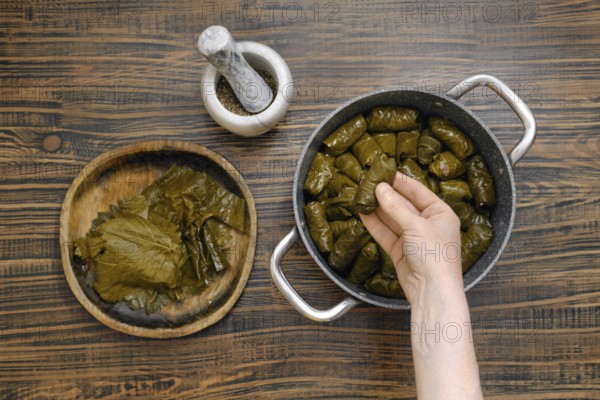 Cooking dolma at home in a cozy kitchen with fresh ingredients and traditional techniques
