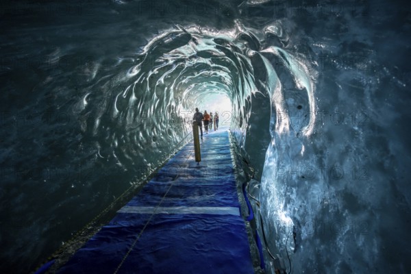Artificial ice cave through the glacier ice, Mer de Glace, Montenvers, Chamonix, Haute-Savoie, France
