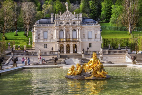 Water parterre with flora fountain and the portal of Linderhof Castle in spring, municipality of Ettal, Ammergau Alps, Ammertal, Upper Bavaria, Bavaria, Germany