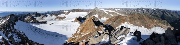 Mountain panorama at Wilder Freiger summit, picturesque high mountain landscape with snow, view of Übeltalferner glacier and rocky mountain peaks Königshofspitz and Sonklarspitze, Wilder Pfaff and Ruderhofspitze, Stubai Alps, South Tyrol, Italy