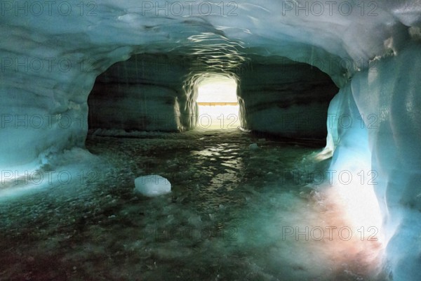 Ice tunnel, illuminated glacier cave, melting ice, illustration, Langjökull glacier, Husafell, Iceland