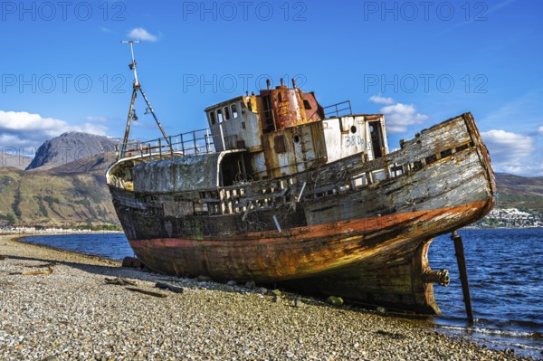 Corpach Wreck or Old Boat of Caol and Nevis Range Mountains, Caol Beach, Corpach, Fort William, Highland, Scotland, UK