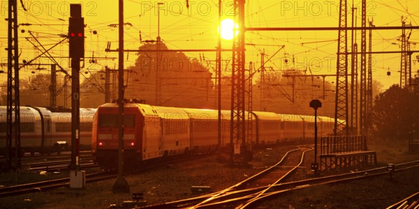Travelling trains at sunrise, Central Station, Dortmund, Ruhr Area, Germany