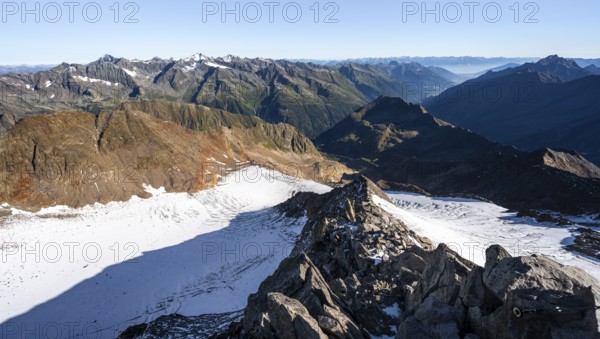 Mountain panorama at the Wilder Freiger summit, picturesque high mountain landscape with rocky ridge, view towards the Stubai Valley with Ruderhofspitze summit and Wilder Freiger Ferner glacier, Stubai Alps, South Tyrol, Italy