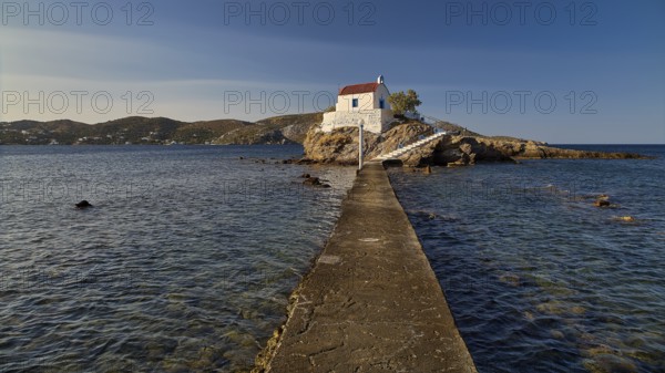 A long pier connects the mainland with a small church on a rock in the sea, chapel, church, Agios Isidoros, rocky islet, Bay of Gourna, Kokkali, Leros, Dodecanese, Greek Islands, Greece