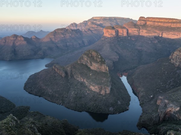 Sunset at Blyde River Canyon with Three Rondawels peak, view of canyon with Blyde River and table mountains in the evening light, canyon landscape, Panorama Route, Mpumalanga, South Africa