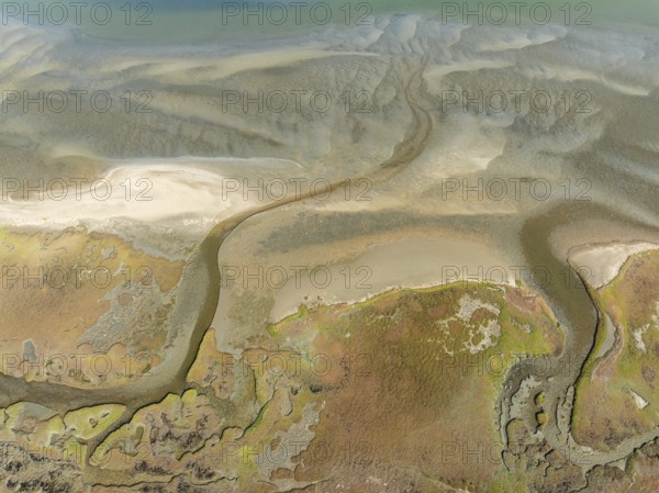 Marshes and streams at low tide in the Walvis Bay Lagoon. Aerial view. Drone shot. Namibia