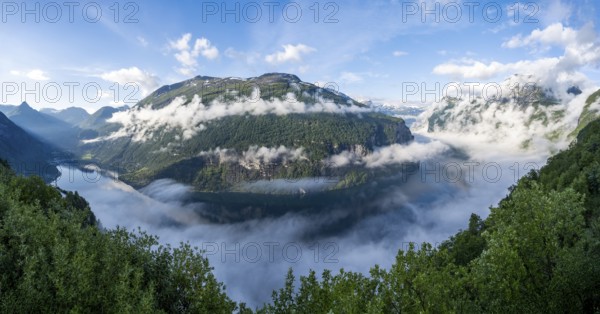 Panorama, view over the Geirangerfjord, atmospheric clouds over the fjord in the morning light, Ørnesvingen viewpoint, near Geiranger, Møre og Romsdal, Norway