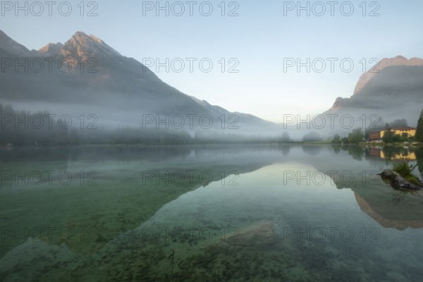 Magical sunrise with fog at Hintersee near Ramsau in Berchtesgadener Land