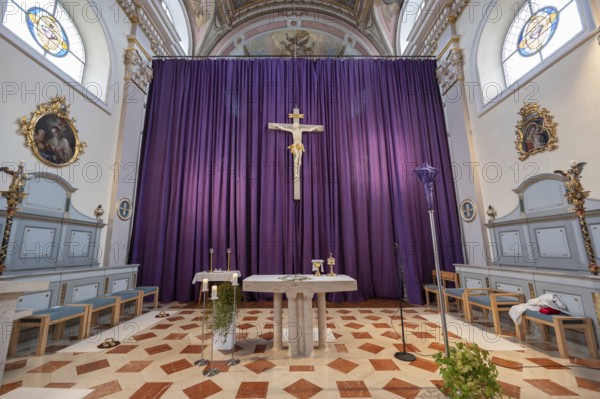 Large purple Lenten cloth in front of the high altar in the baroque parish church of St Nicholas, built between 1722 and 1724, Kirchacker 20, Tannheim, Austria