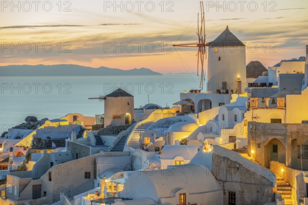 Windmills evening mood illuminated Oia Santorini Greece