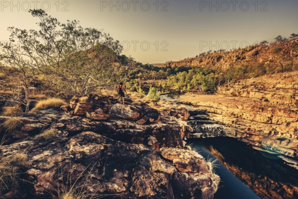 Bell Gorge waterfall, a body of water in north-west Australia in the Kimberley. Sunrise in the outback, Australia