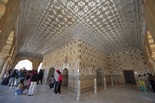 Visitors in the audience hall in the Amber Fort or fortress, Jaipur, Rajasthan, India