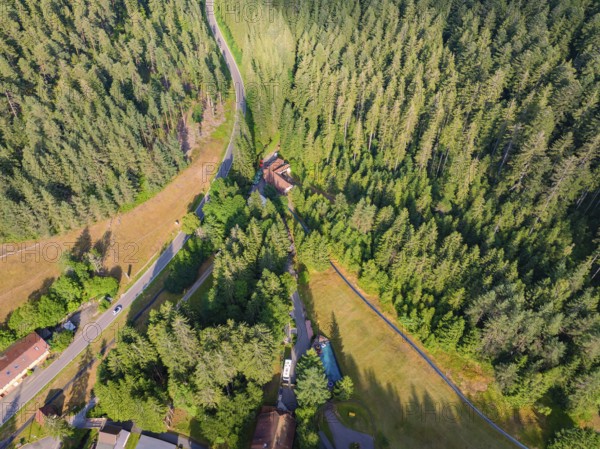 Bird's eye view of a winding road and green forests with a slight incline, Retro Freizeitpark Poppeltal Riesenrutschbahn, Enzklösterle, Black Forest, Germany