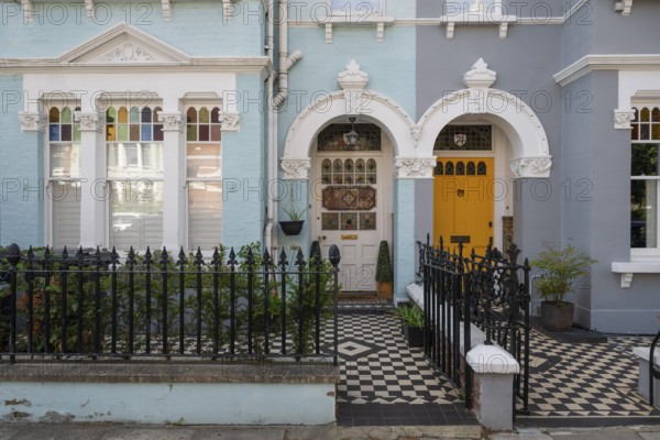 Victorian entrances, yellow door, black and white tile pattern, Kensington, London, England, Great Britain