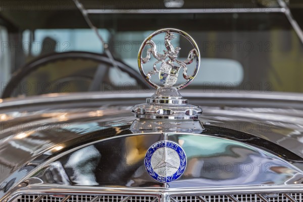 Mercedes-Benz 770 Large Mercedes Cariolet F from 1932, driven by the former German Kaiser Wilhelm II in his exile in Holland. The Hohenzollern coat of arms on the radiator instead of the Mercedes star. The Mercedes-Benz Museum in Stuttgart presents a journey through the automotive history of the global corporation. Collection 4, Gallery of Names. The history of the Mercedes star begins with the first automobile in 1886. 160 vehicles are on display. Stuttgart, Baden-Württemberg, Germany